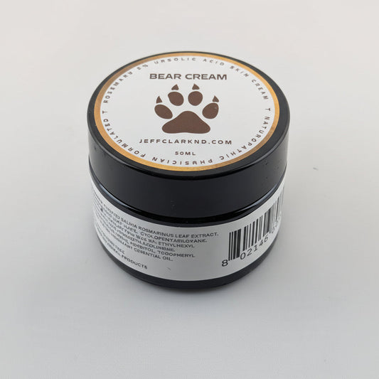 Jar of Bear Cream with a paw print logo on a white background